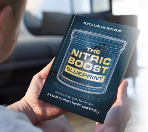 Person holding 'The Nitric Boost Blueprint' book, an exclusive bonus guide on men’s health, energy, and vitality.